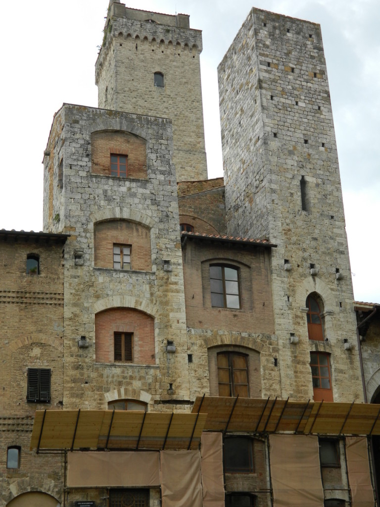 Towers surrounding Piazza Cisterna, San Gimignano, Tuscany.