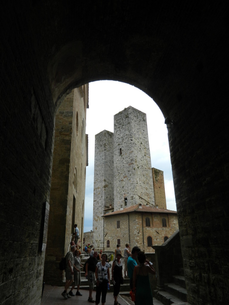 Towers seen from an arch near the Duomo, San Gimignano, Tuscany.